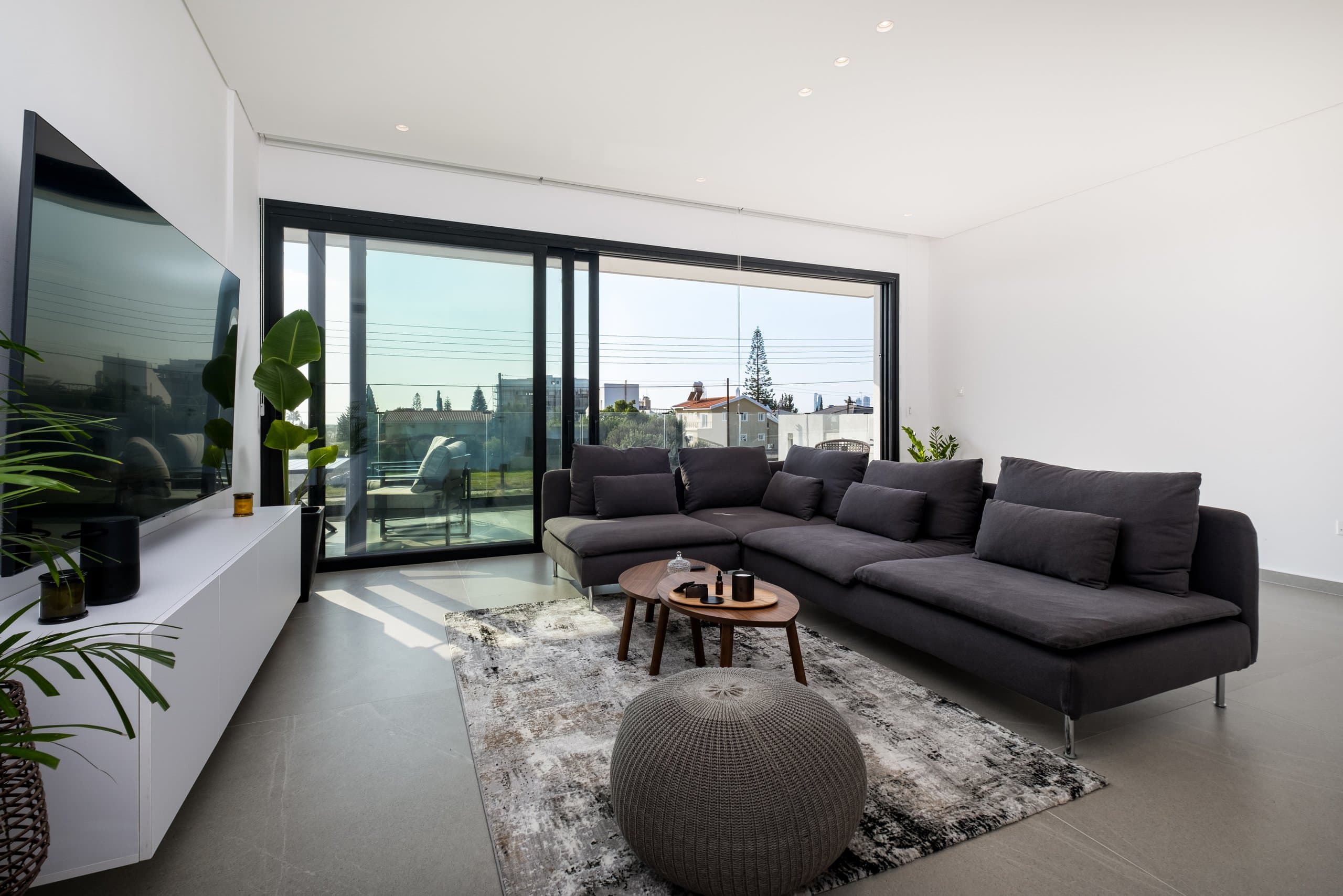 A finished Simplicity 2 living room opening onto its sea-view balcony